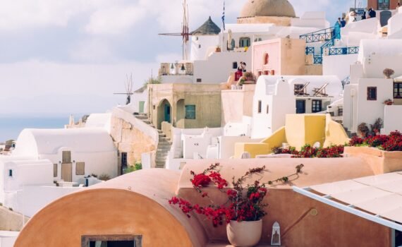 A vertical shot of beautiful buildings in Santorini island in the Aegean Sea, Cyclades, Greece